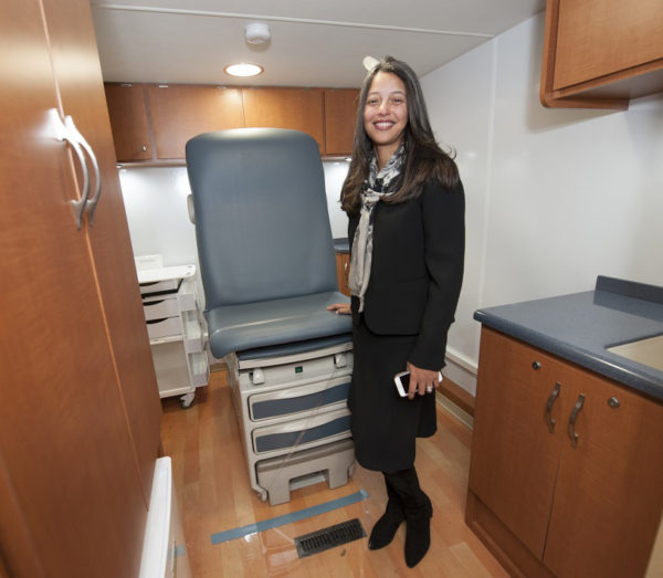 Elsie Taveras, MD, MPH, executive director of The Kraft Center, visits the CareZONE van at its recent unveiling.