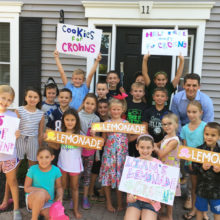 Members of the Liam Doherty’s lemonade crew pose for a photo along with Jess Kaplan, MD (upper right), on the day of Liam's fundraiser for Crohn's disease research.