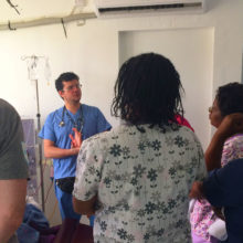 Mass General’s Global Disaster Response team leader Kevin Murphy, RN, far left, and Juan Pablo Domecq Garces, MD, meet with colleagues in the Dialysis Unit of Dominica’s Princess Margaret Hospital.
