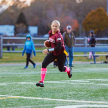 Erin Finelli on the run at the Mom Ball: Battle for the Battle! flag football game at the Pingree School in South Hamilton.