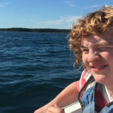 Ethan Datsis at his favorite place - his family's boat - one year after his surgery. (Photo courtesy of Ellen Datsis.)