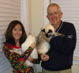 Lynn and Joe Gambill with their cats, Simba and Rascal.