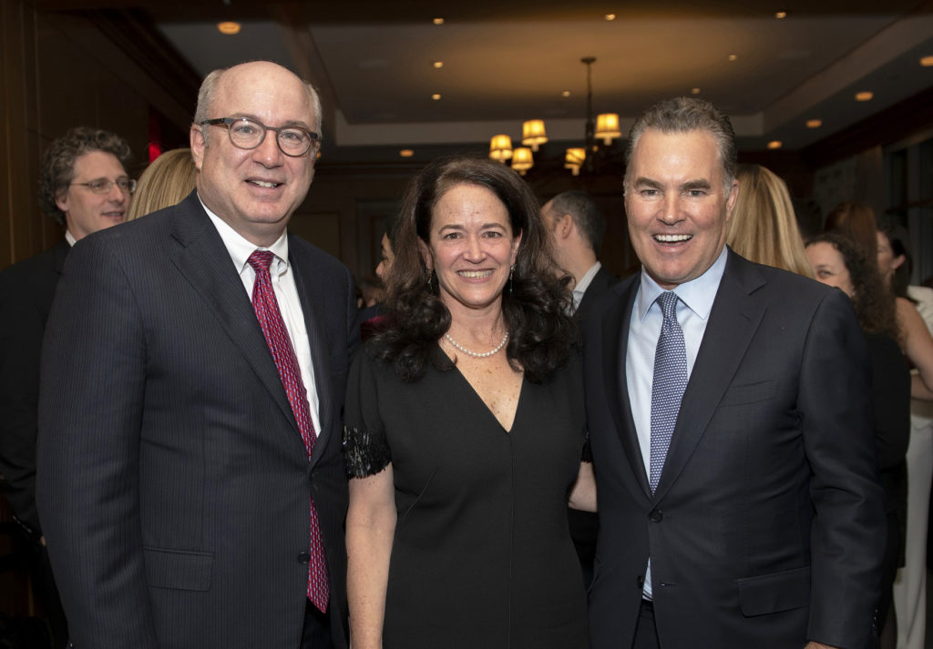 Peter L. Slavin, MD, Mass General president (left), joined Merit Cudkowicz, MD, chief of Neurology and director of the Healey Center, and Sean Healey in celebrating the Healey gift. 