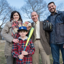Caitlin and Rich Hill, with their son Brice, are happy to support the work of David Sweetser, MD, PhD (center, wearing tie), who helped solve their family’s genetic mystery.