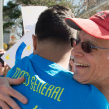 Howard Weinstein, MD, MGH Boston Marathon team captain, embraces his 2014 patient-partner Lorenzo Tejada, at Mile 20.