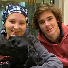 Maddie Schiller (left) with her dog, Slater, and older brother, Cole Schiller. Maddie, who has leukemia, is raising money for families facing cancer and financial difficulties.