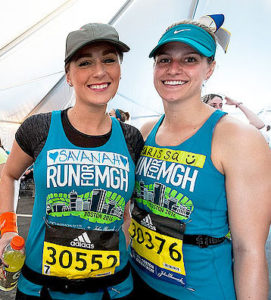 John Hancock provides Mass General runners with bib numbers for the Boston Marathon.