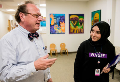 Christopher McDougle, MD, visits with Seyma Soganda, a medical student from Turkey, who was at the Lurie Center for a one-month clerkship.