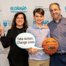 Benjamin Metsch (center), with his parents, Renee Metsch and David Metsch, held a basketball tournament to raise money for breast cancer research at Mass General.