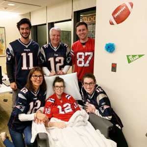 Michaela enjoyed the football party, surrounded by those she loved: from bottom left, clockwise are her mother, Iris; boyfriend, Julian Fricks; father, Michael; her sister Kara’s fiancé, Bryce Stocks; and Kara herself.