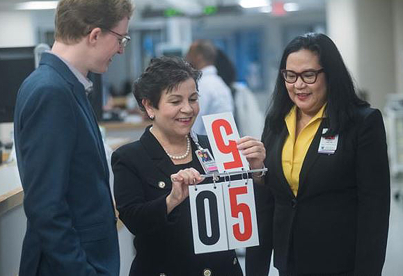 Team members who worked on a flip-chart project included, from left, Dominic Breuer, PhD; Lillian Ananian, RN, PhD, MSN; and Jeanette Livelo, DNP, MS/MBA, RN, NEA-BC.