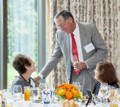 Roman DeSanctis, MD, Phillips Society Ambassador and director emeritus of Clinical Cardiology, chats with other society members before the 13th Phillips Society luncheon.