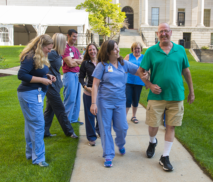 Enjoying an informal post-transplant reunion are, from left, Jamie Ronin, RN; critical care tech Liz Ralph; Shawn McEntee, RN; Jennifer O’Malley, RN; physical therapist Sarah Wright and Eileen and Dennis Kaminski.