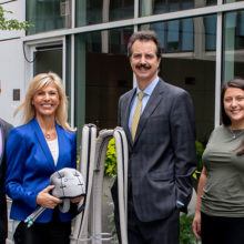 Earl and Maria Winthrop join oncologist Steven Isakoff, MD, PhD, and Dina Hagigeorges, clinical research coordinator to display the scalp cooling equipment that helps protect chemotherapy patients from hair loss.