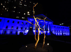 The Bulfinch building lit up in blue, to show appreciation for frontline workers in the community.