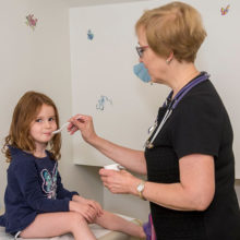 Lisa Steib, RN, conducts food allergy testing on an MGHfC patient.