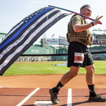 Runner Christopher Marden crosses home plate at the 2019 Run to Home Base.