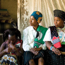 Krista Dong, MD (far right), with traditional healers in Africa working to identify HIV infection early.