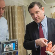 From left, technologies specialist Carl Blesius, MD, and James Gordon, MD, MPA, chief learning officer, demonstrate intubation using a silicone dummy in the Learning Lab.