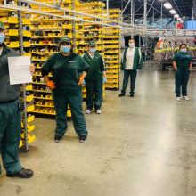 UniFirst Team Partners in Los Angeles, CA, maintain a safe social distance while helping to fulfill donation requests from local businesses for safety supplies and PPE.